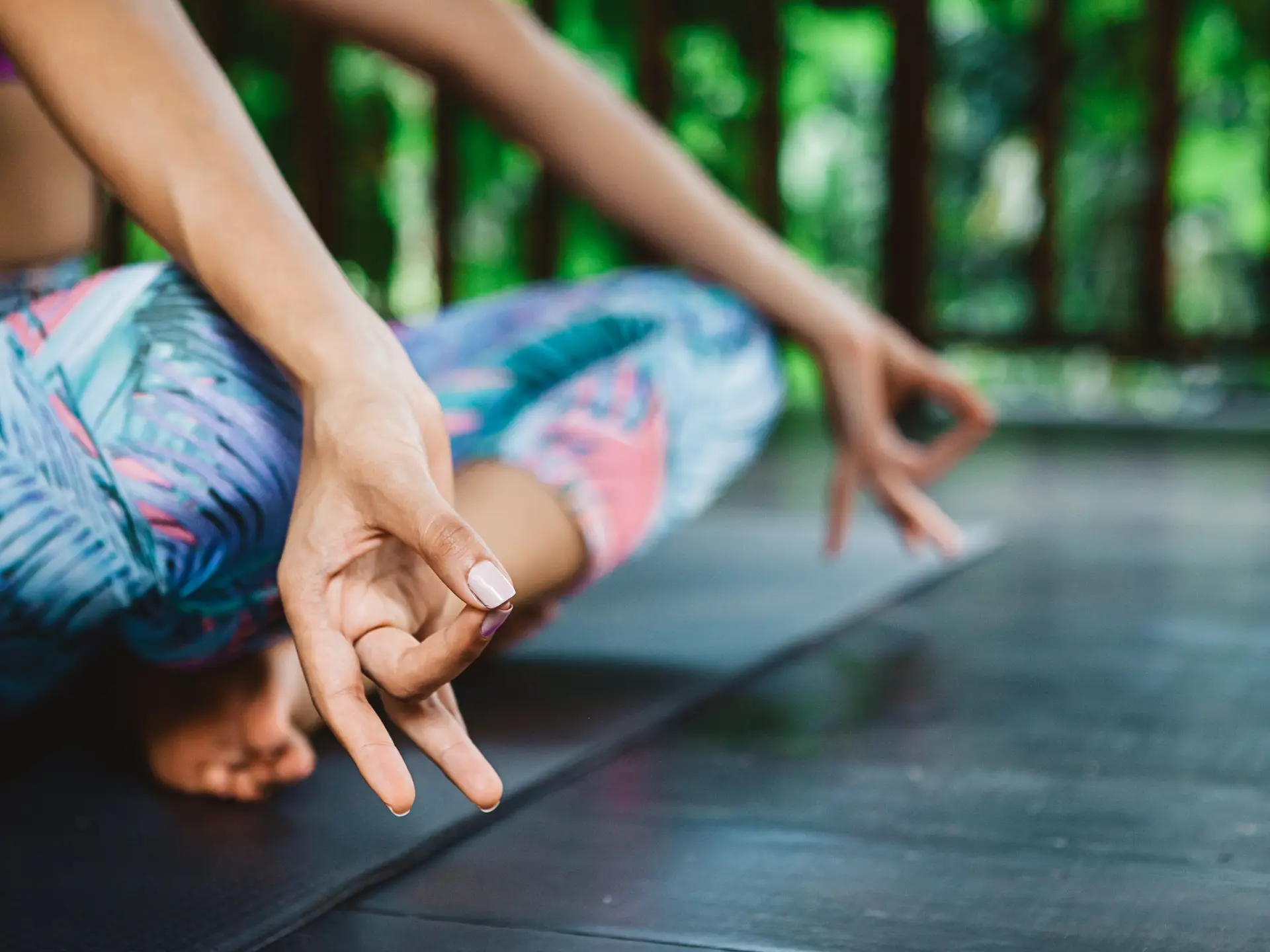 shutterstock_497435869 Young girl practicing yoga and meditation during vacation yoga retreat in Bali, fingers in mudra.jpg