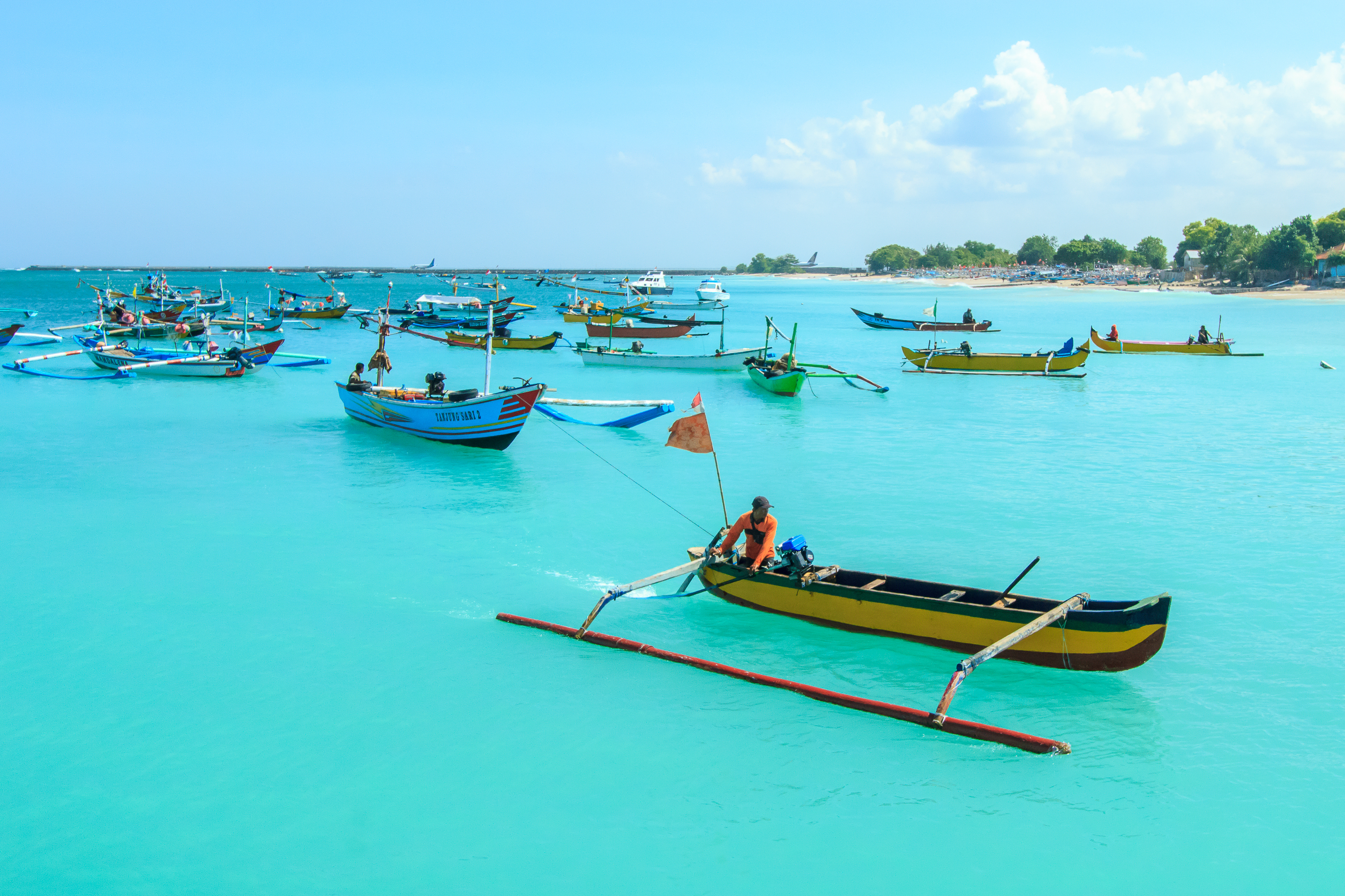 shutterstock_622035740 Unidentified fisherman on a boat in Jimbaran Beach, Bali, Indonesia..jpg