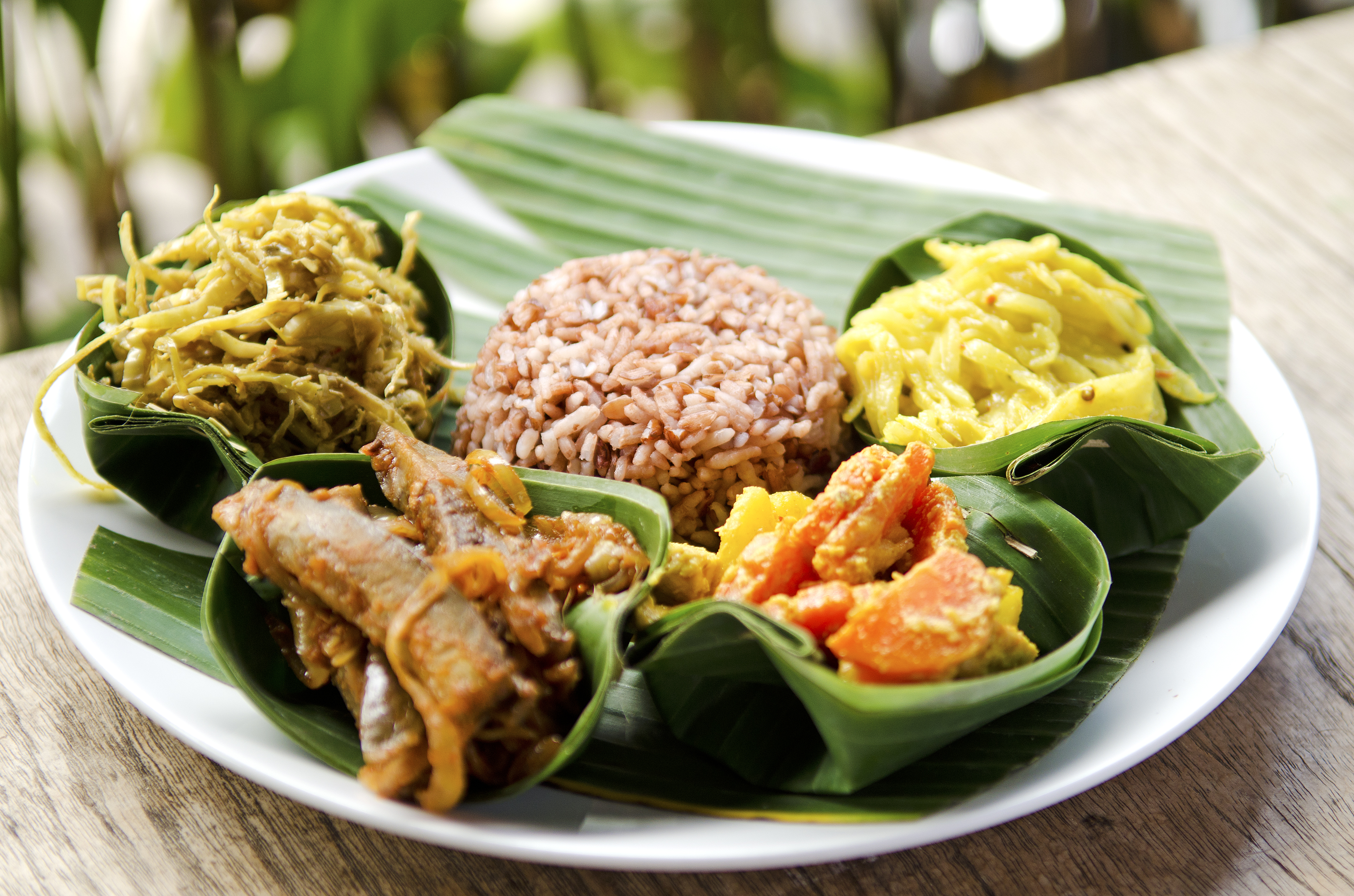 shutterstock_77400334 indonesian food in bali, several curries and rice.jpg