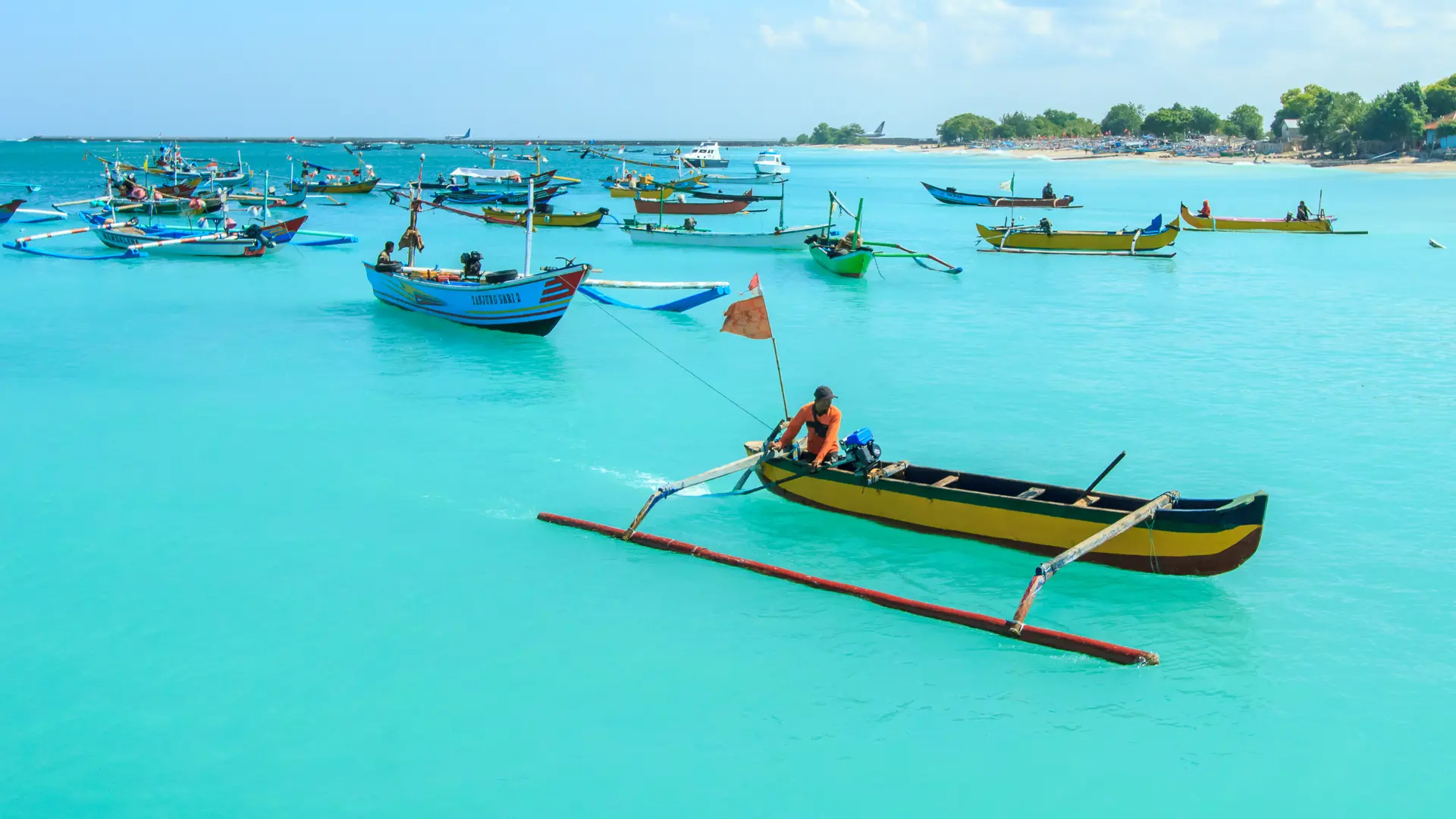 shutterstock_622035740 Bali, Indonesia-June 1, 2014Unidentified fisherman on a boat in Jimbaran Beach, Bali, Indonesia..jpg