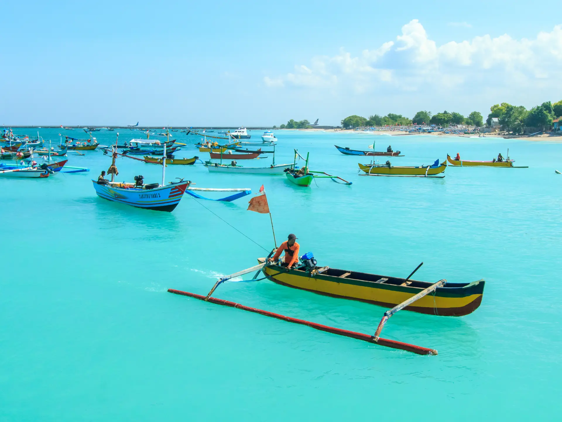 shutterstock_622035740 Bali, Indonesia-June 1, 2014Unidentified fisherman on a boat in Jimbaran Beach, Bali, Indonesia..jpg