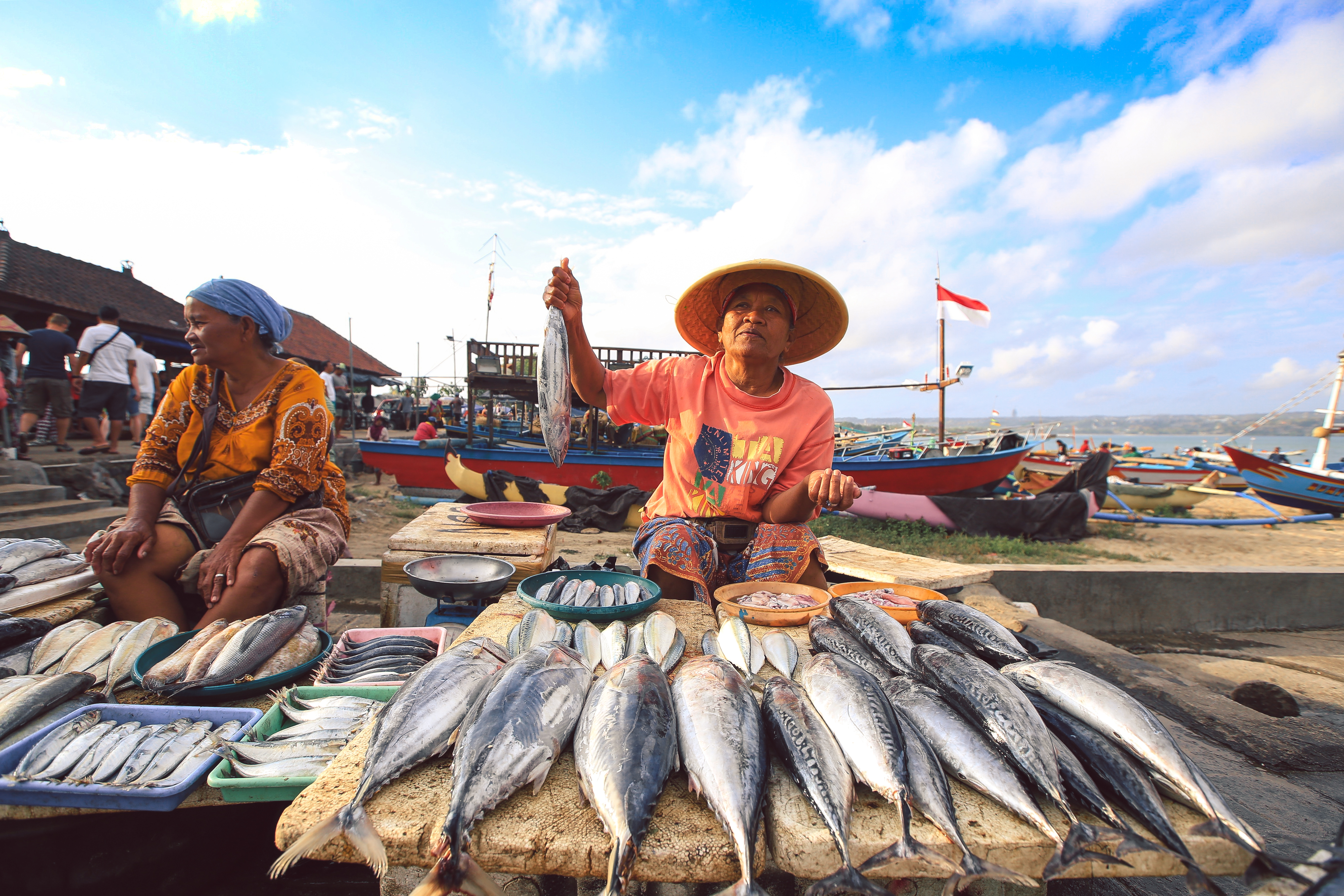 Balinese fishmonger sells fish in the morning market in Kedonganan - Passer Ikan, Jimbaran beach.jpg