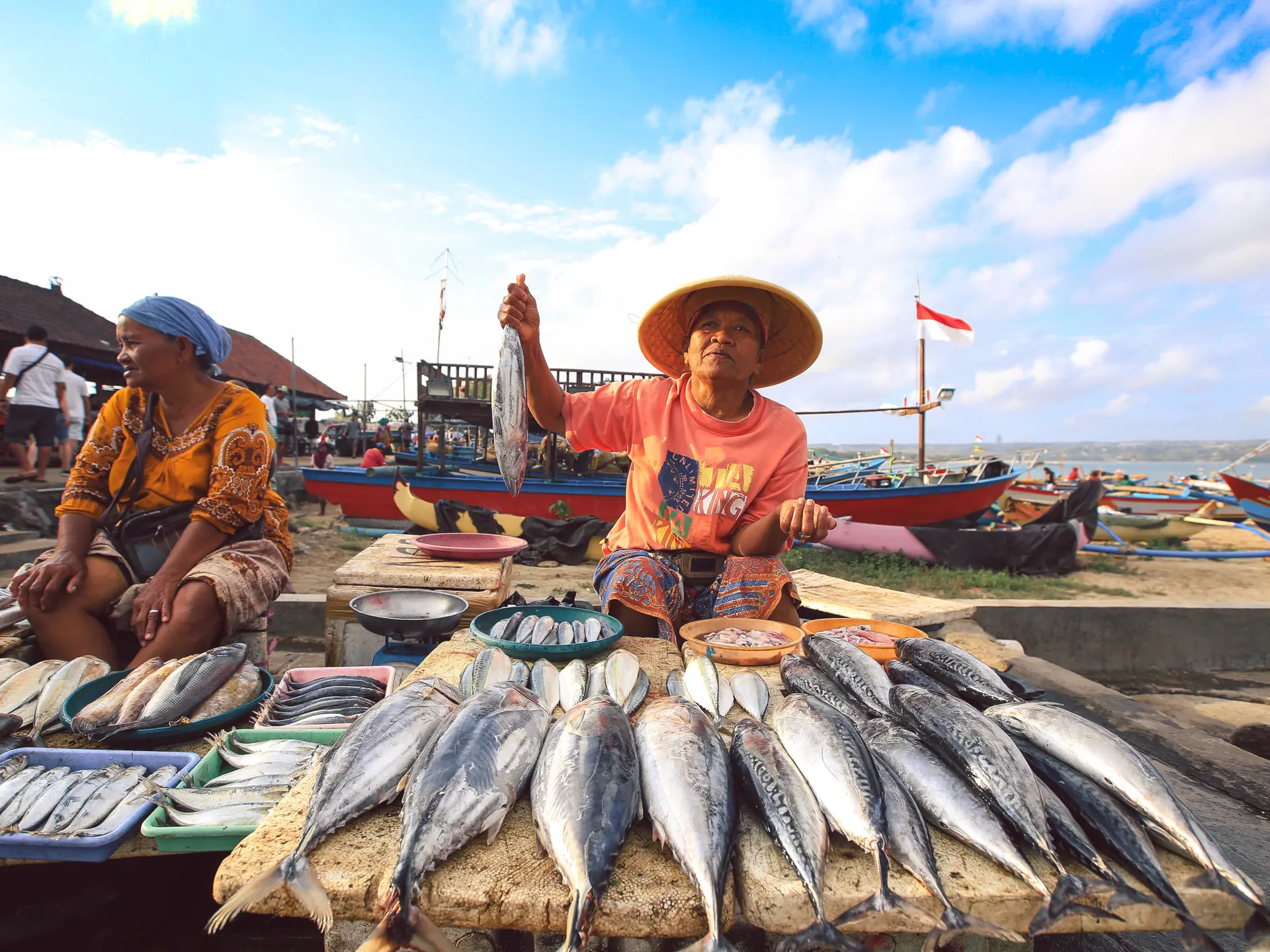 Balinese fishmonger sells fish in the morning market in Kedonganan - Passer Ikan, Jimbaran beach.jpg