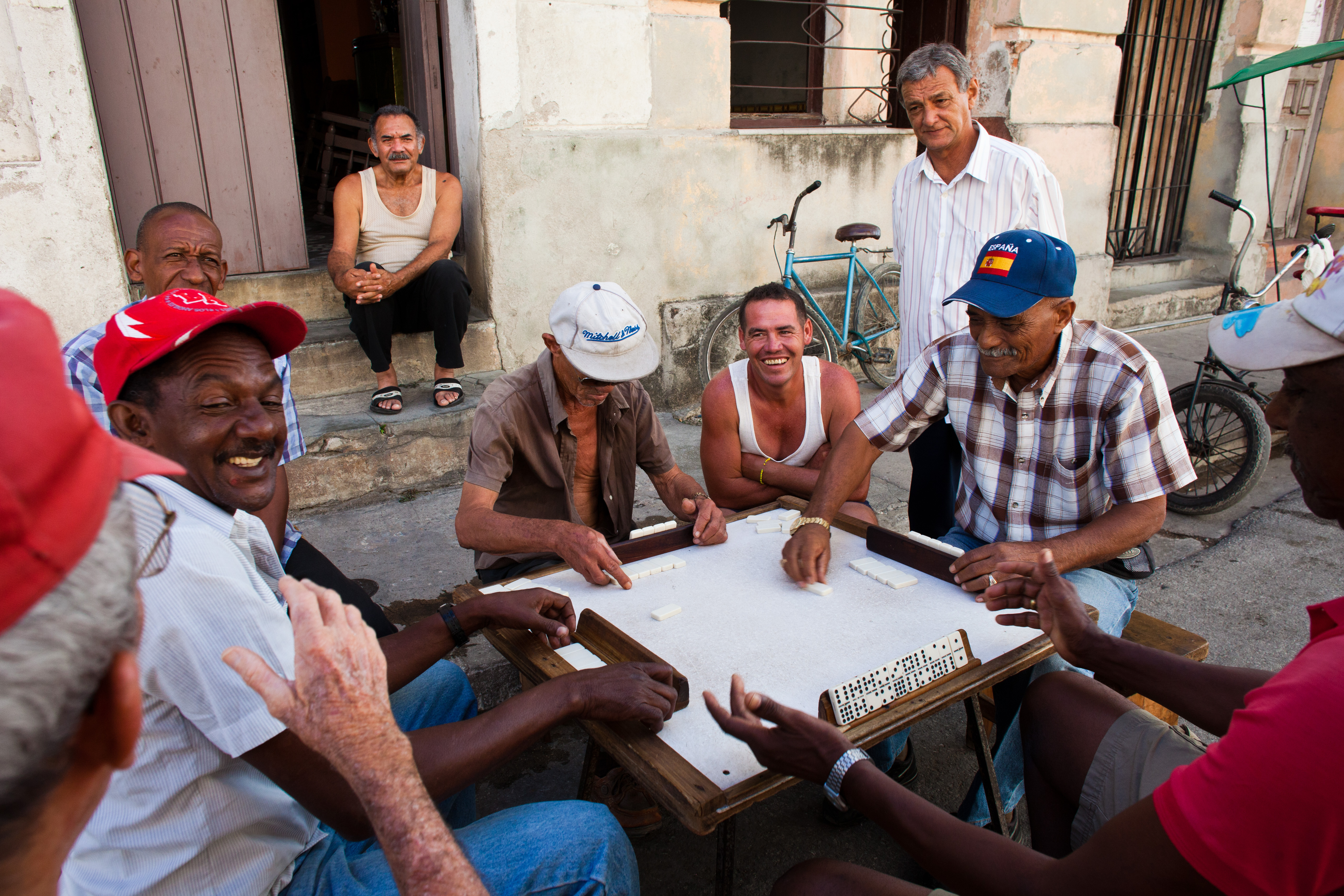 shutterstock_150009776 man play dominos on the street in Camaguey.jpg