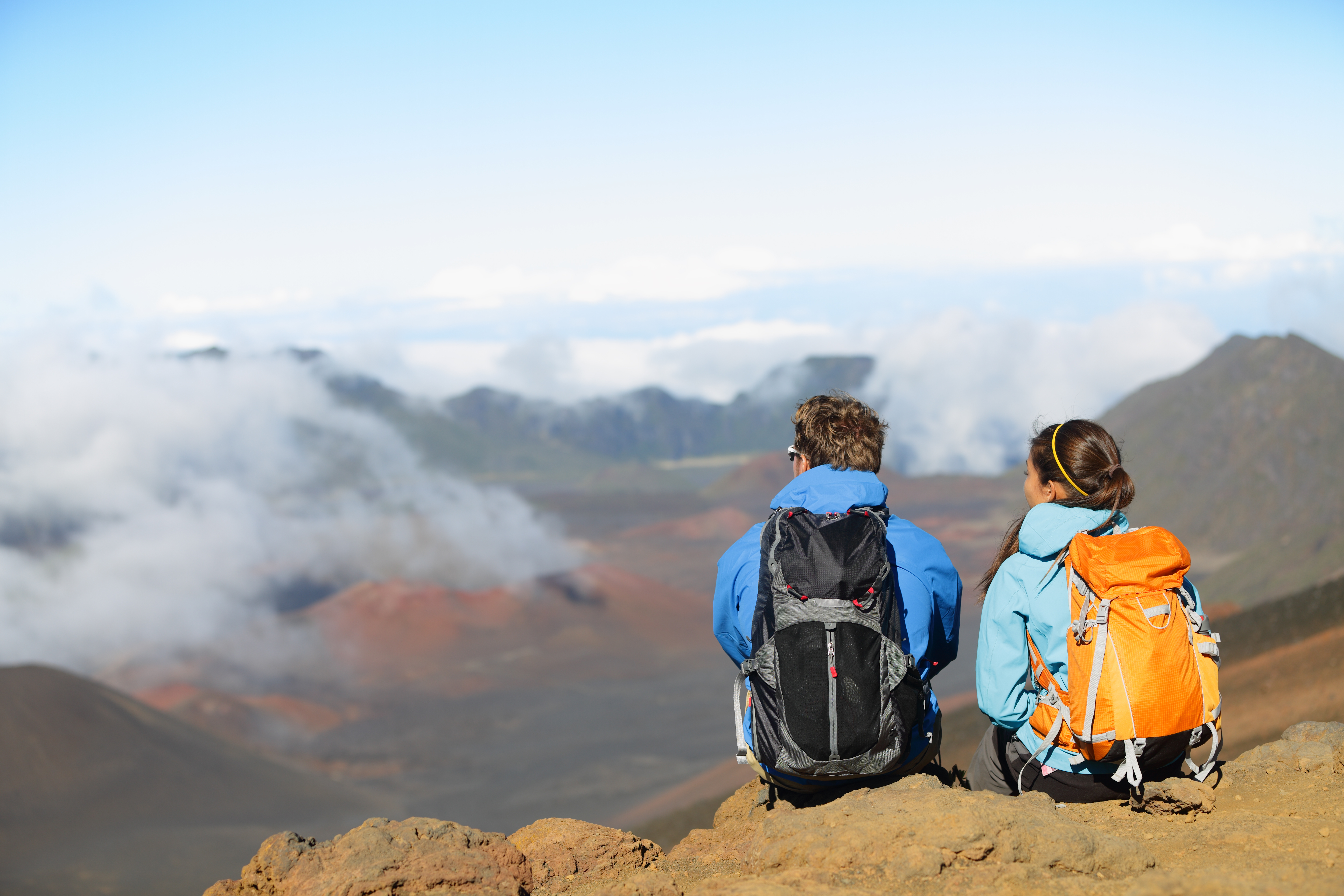 Hikers sitting enjoying view on volcano. East Maui Volcano, Haleakala National Park, Hawaii..jpg