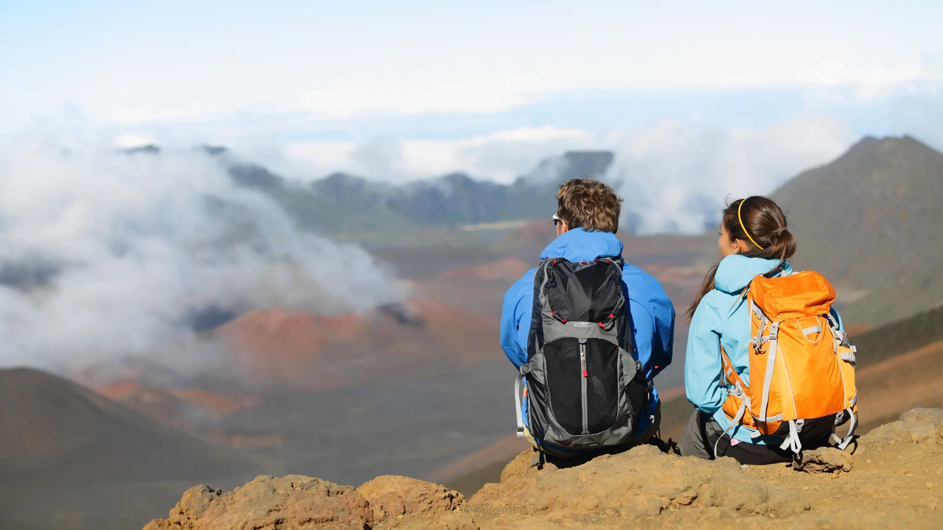 Hikers sitting enjoying view on volcano. East Maui Volcano, Haleakala National Park, Hawaii..jpg
