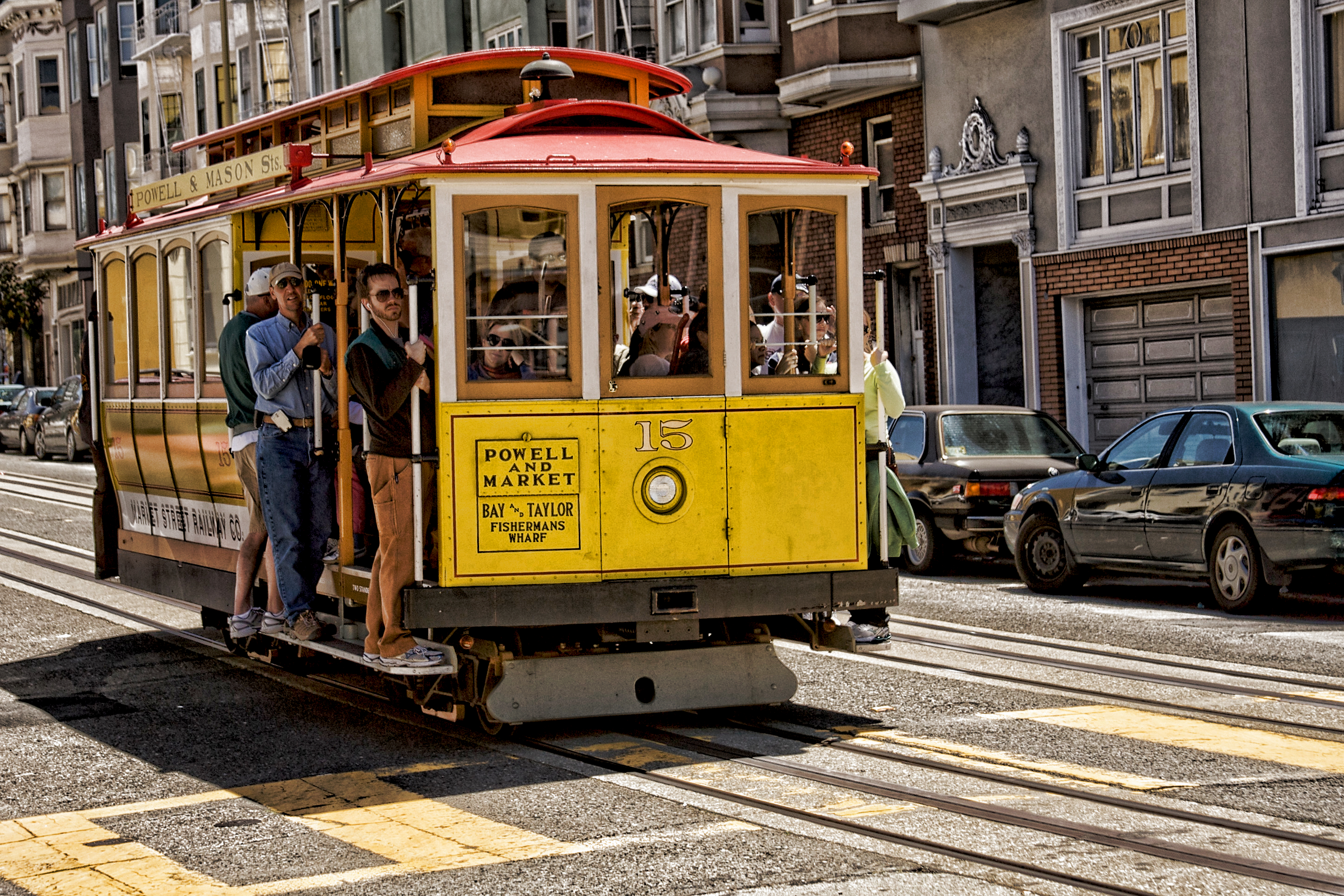 shutterstock_99760811 SAN FRANCISCO Ca. - MAY 6 Passengers ride in a cable car.jpg