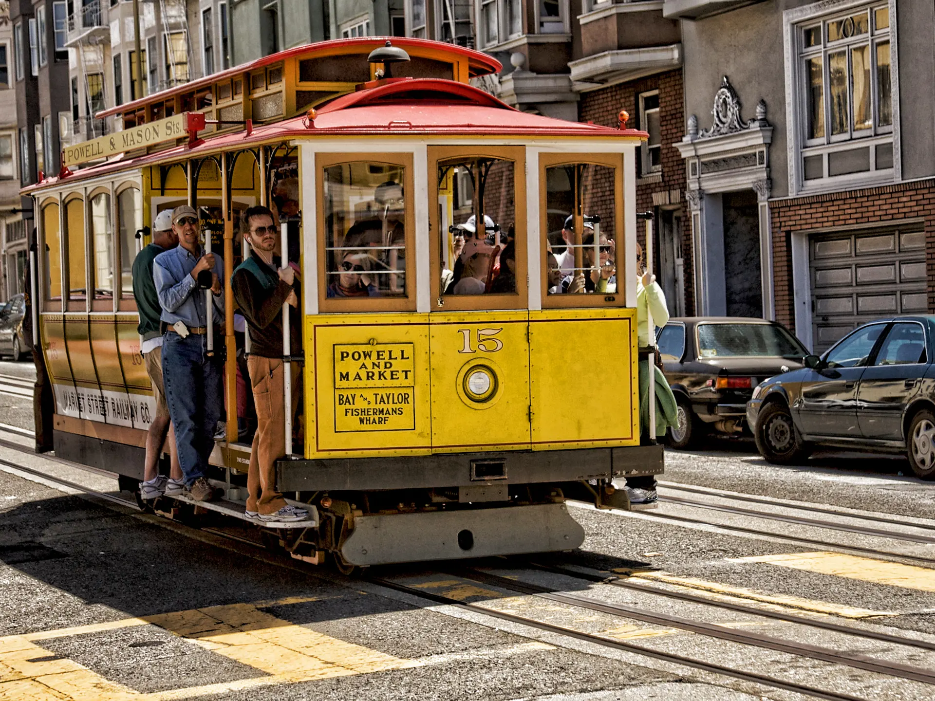 shutterstock_99760811 SAN FRANCISCO Ca. - MAY 6 Passengers ride in a cable car.jpg