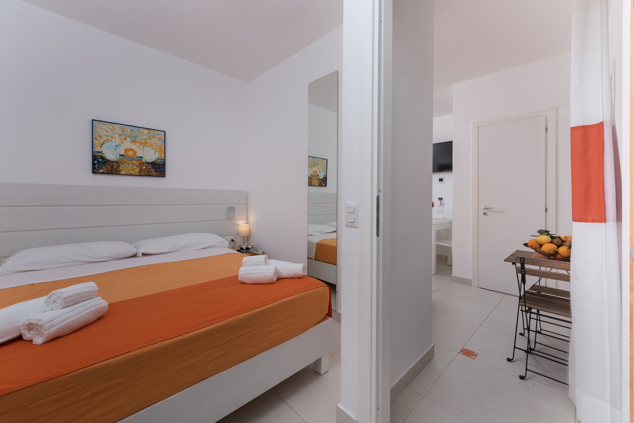 Se på soverommet på Residence Le Palme