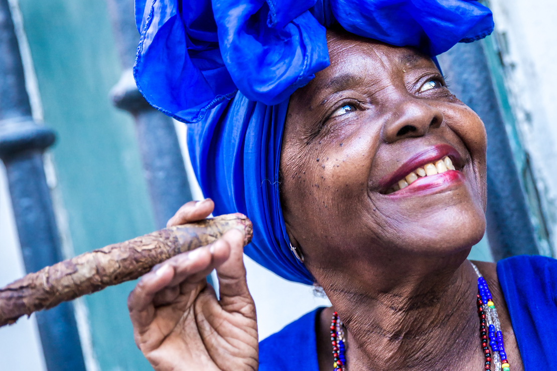 shutterstock_301377860 Portrait of african cuban woman smoking cigar in Havana, Cuba.jpg