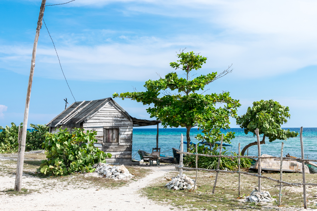 shutterstock_353817056 Fisherman's cottage by the sea in Playa de Giron, Cuba..jpg