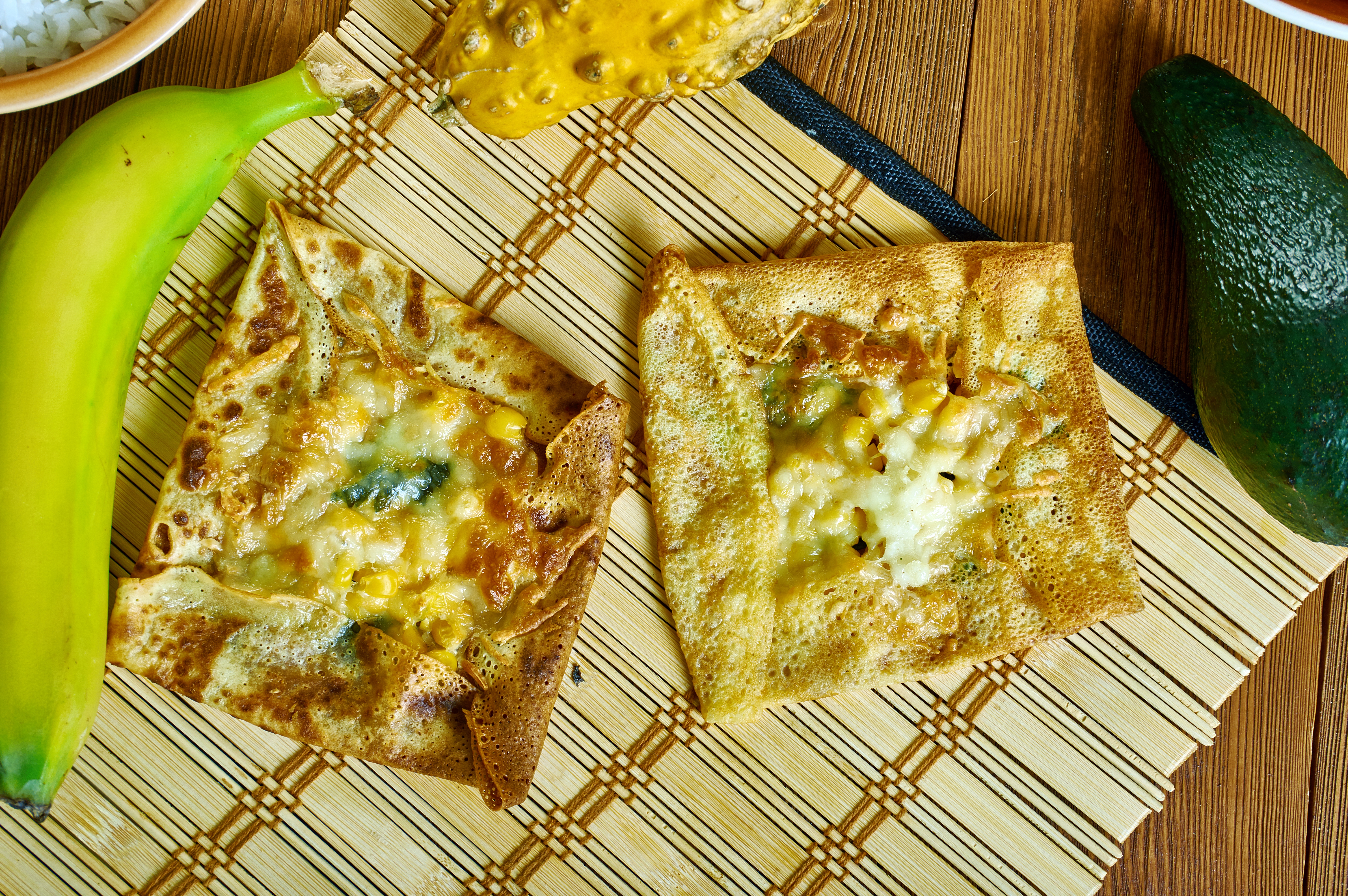 Shutterstock 1627360132 Zanzibar Pizza, Crispy Pancakes With As Many Meats, Sweets, Or Vegetables , Tanzanian Cuisine, Traditional Assorted African Dishes, Top View.