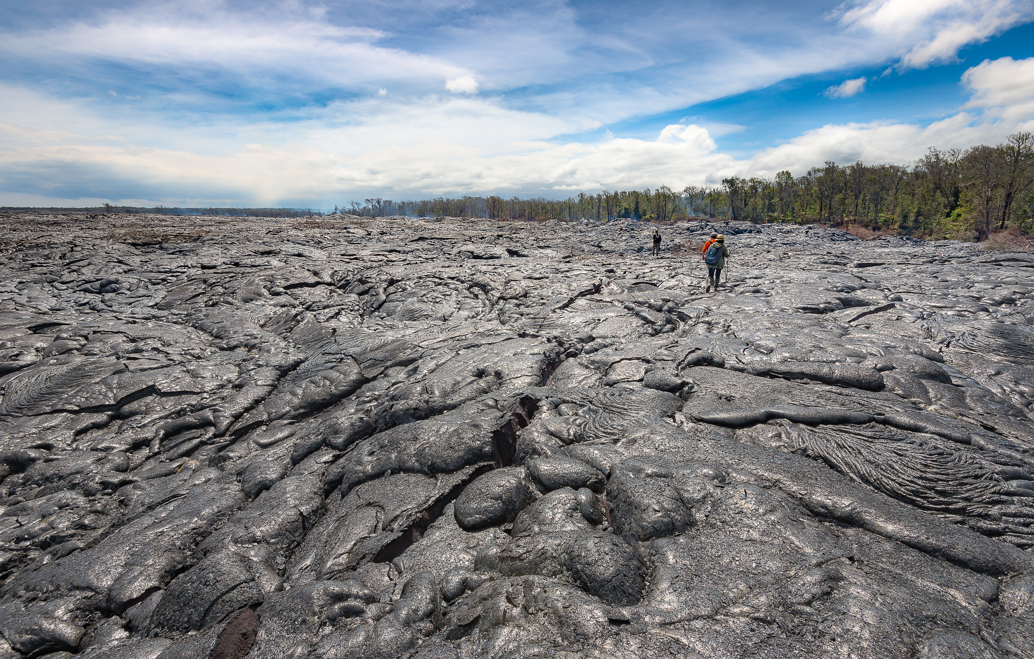 shutterstock_508860874 Hiking on extremely hot lava bed. Advanture activity in Hawaii Vocalnoes National Park.jpg