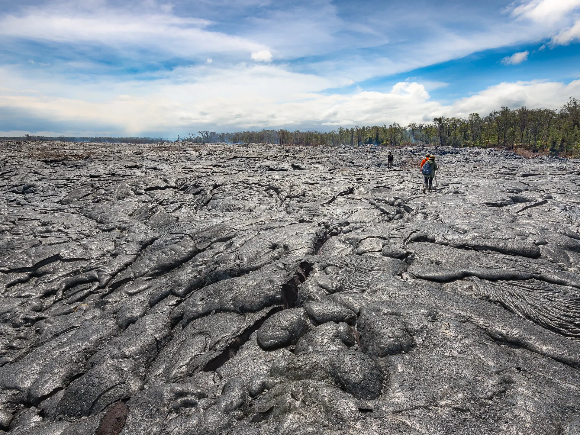 shutterstock_508860874 Hiking on extremely hot lava bed. Advanture activity in Hawaii Vocalnoes National Park.jpg
