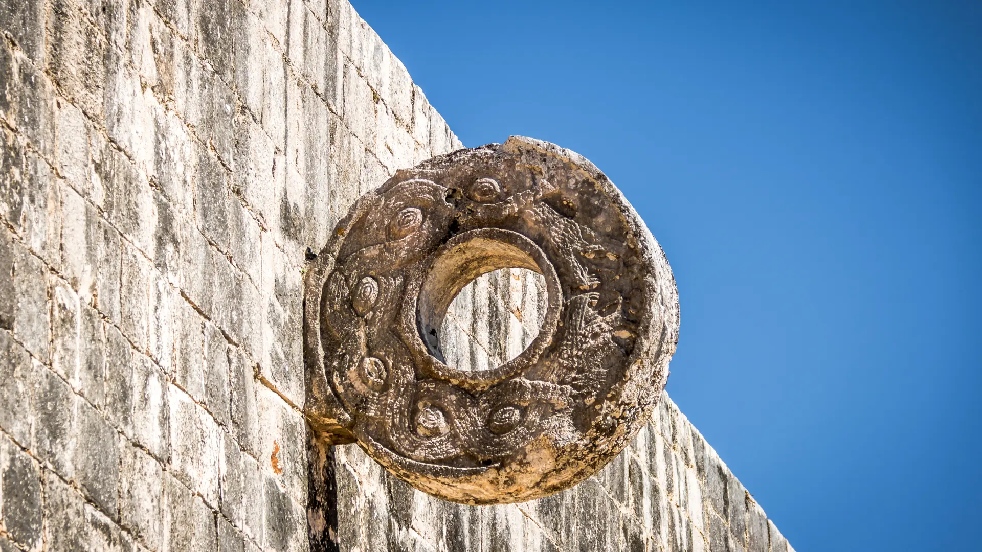 shutterstock_499950019 Detail of hoop at ball game court (juego de pelota) at Chichen Itza - Yucatan, Mexico.jpg