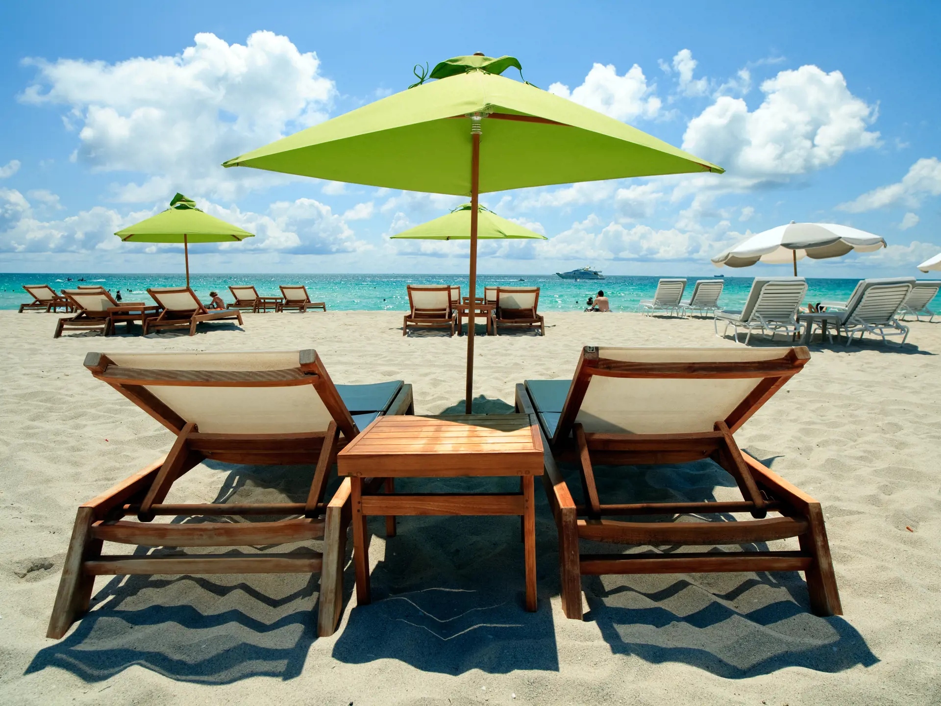 shutterstock_53590102 South Beach Lounge Chairs and Umbrellas.jpg