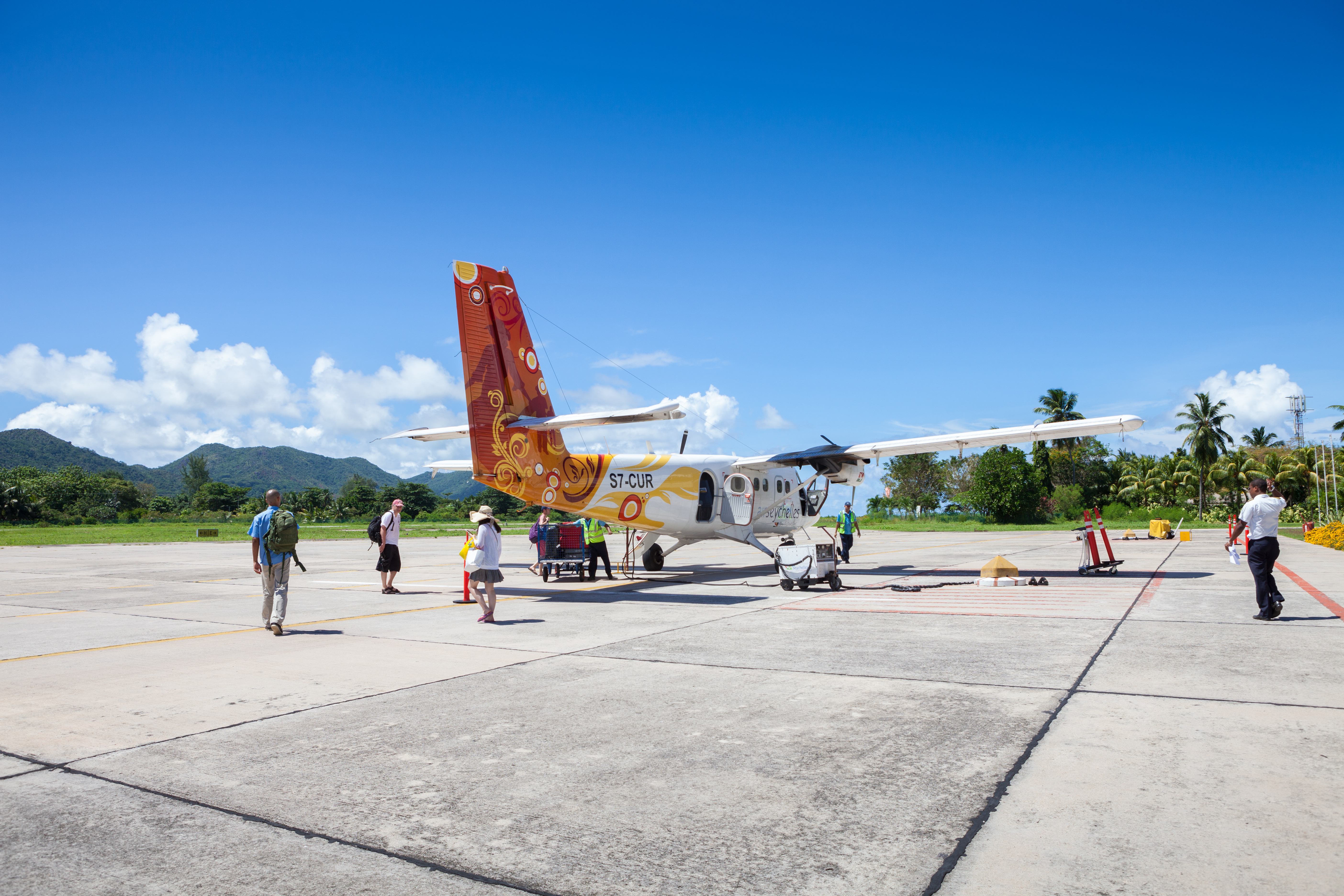 shutterstock_720707206 Praslin, Seychelles Passengers at the airport go on board the aircraft Air Seychelles, Praslin, Seychelles..jpg