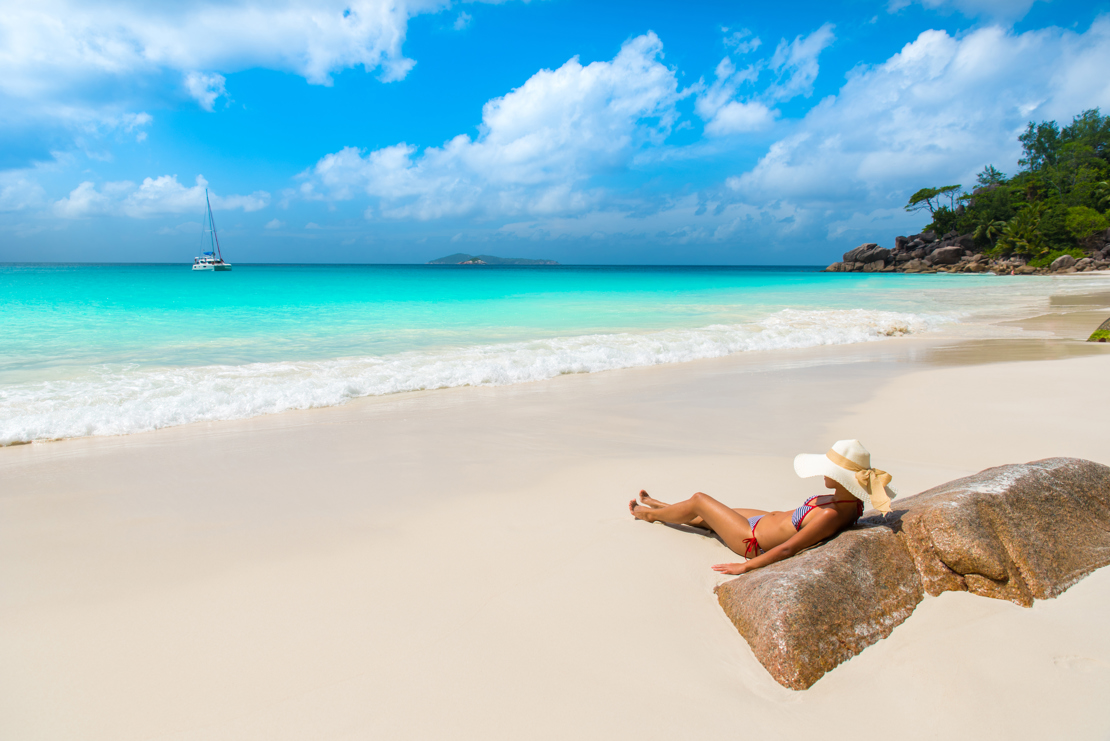 shutterstock_281499635 Girl at beautiful beach - Anse Georgette - Island Praslin at Seychelles.jpg