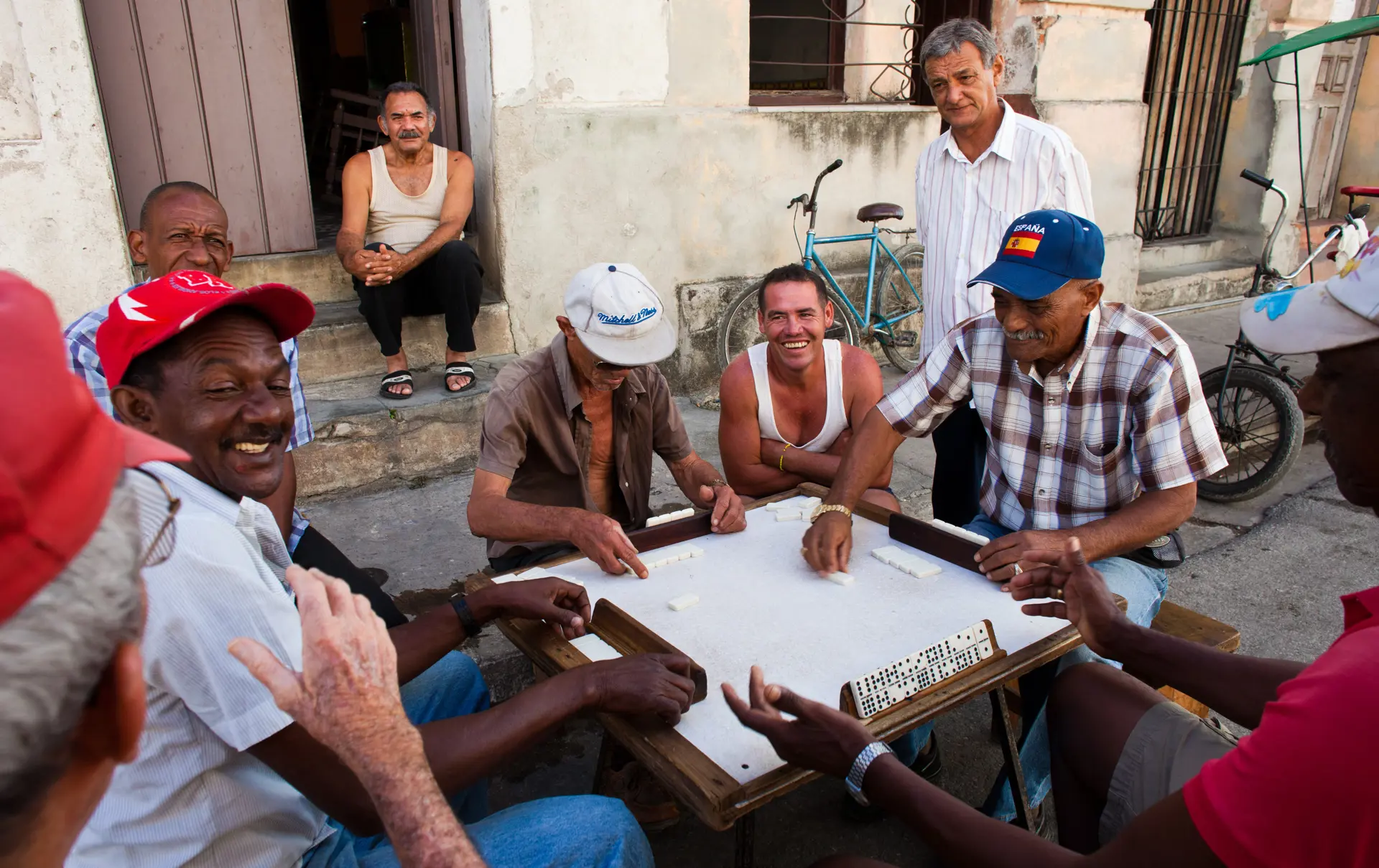 shutterstock_150009776 man play dominos on the street in Camaguey.jpg