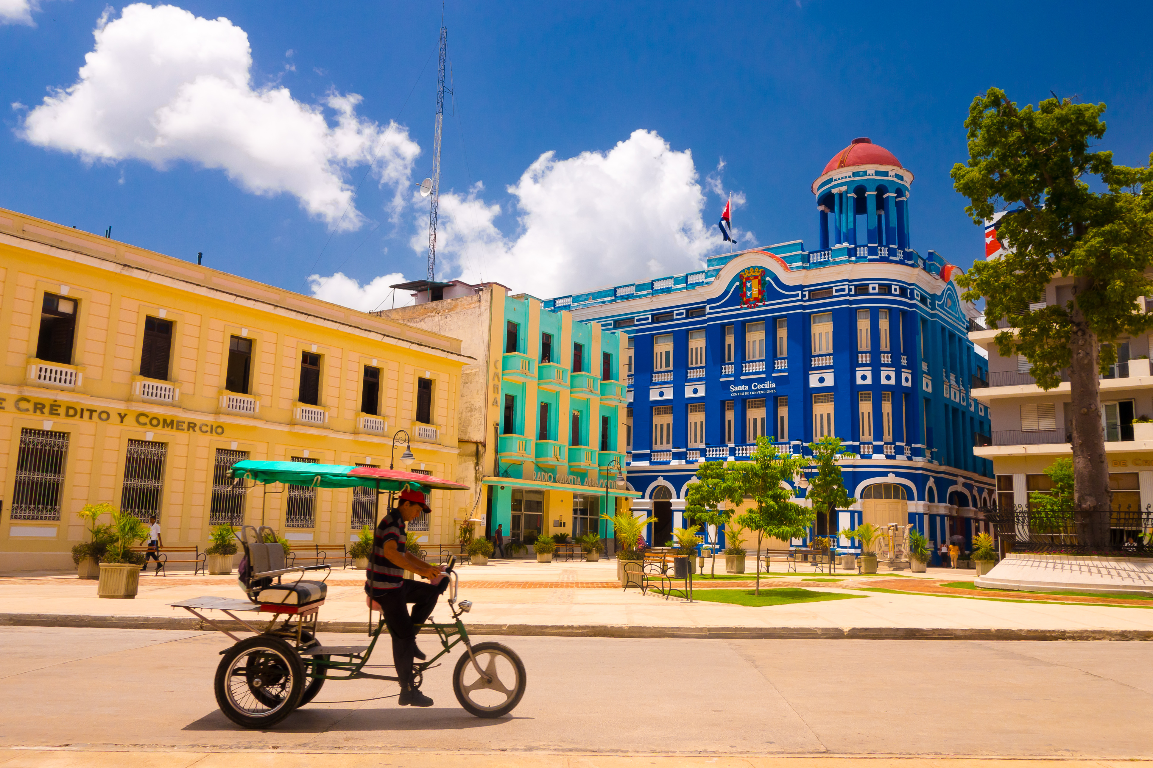 shutterstock_319284563 CAMAGUEY Street view of UNESCO heritage city centre, old square with bicycles used for transport.jpg