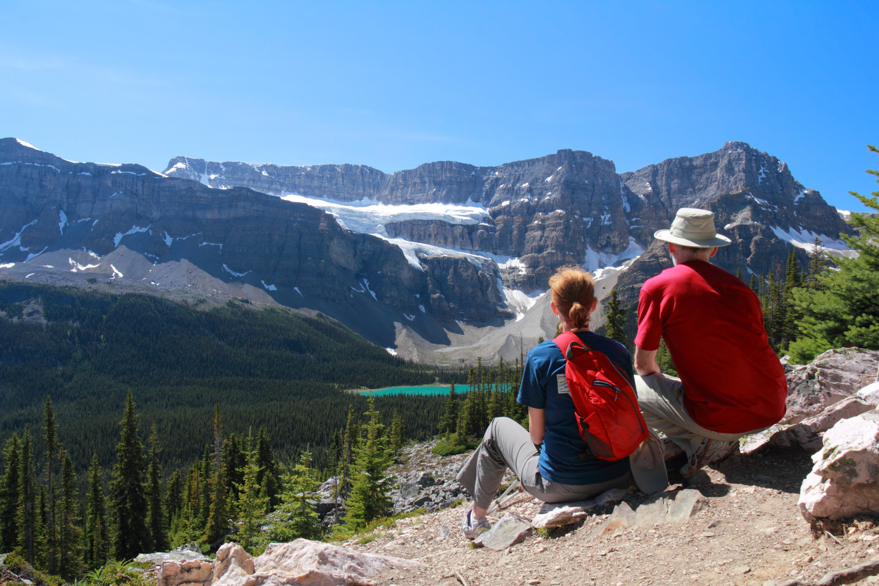Shutterstock 84364120 Couple Looking Out Over Turquoise Mountain And Lake Jasper National Park.
