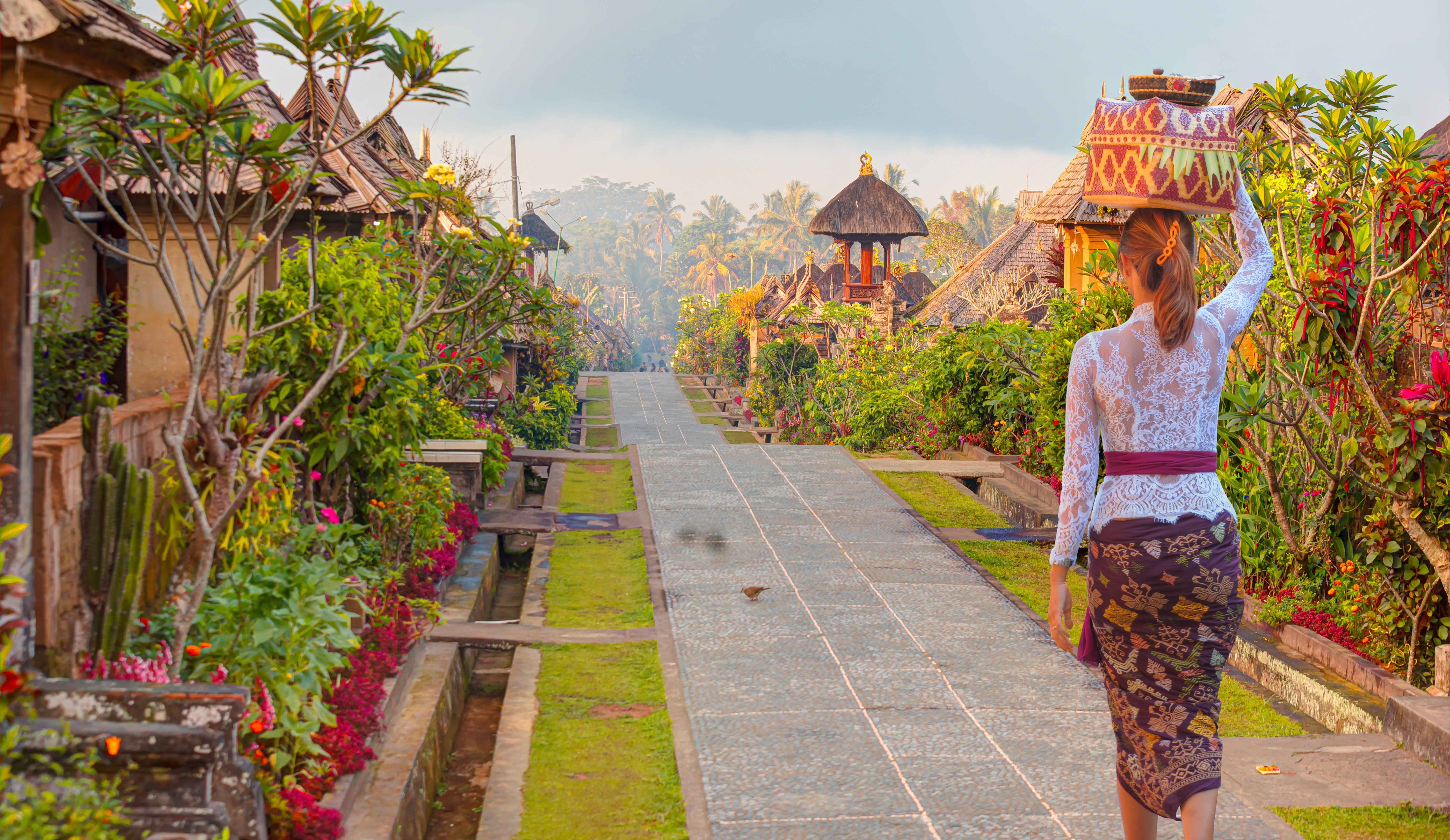 Shutterstock 2246640537 (Beautiful Balinese Girl In Traditional Costume Walking Penglipuran Is A Traditional Oldest Bali Village At Bangli Regency Bali, Indonesia)