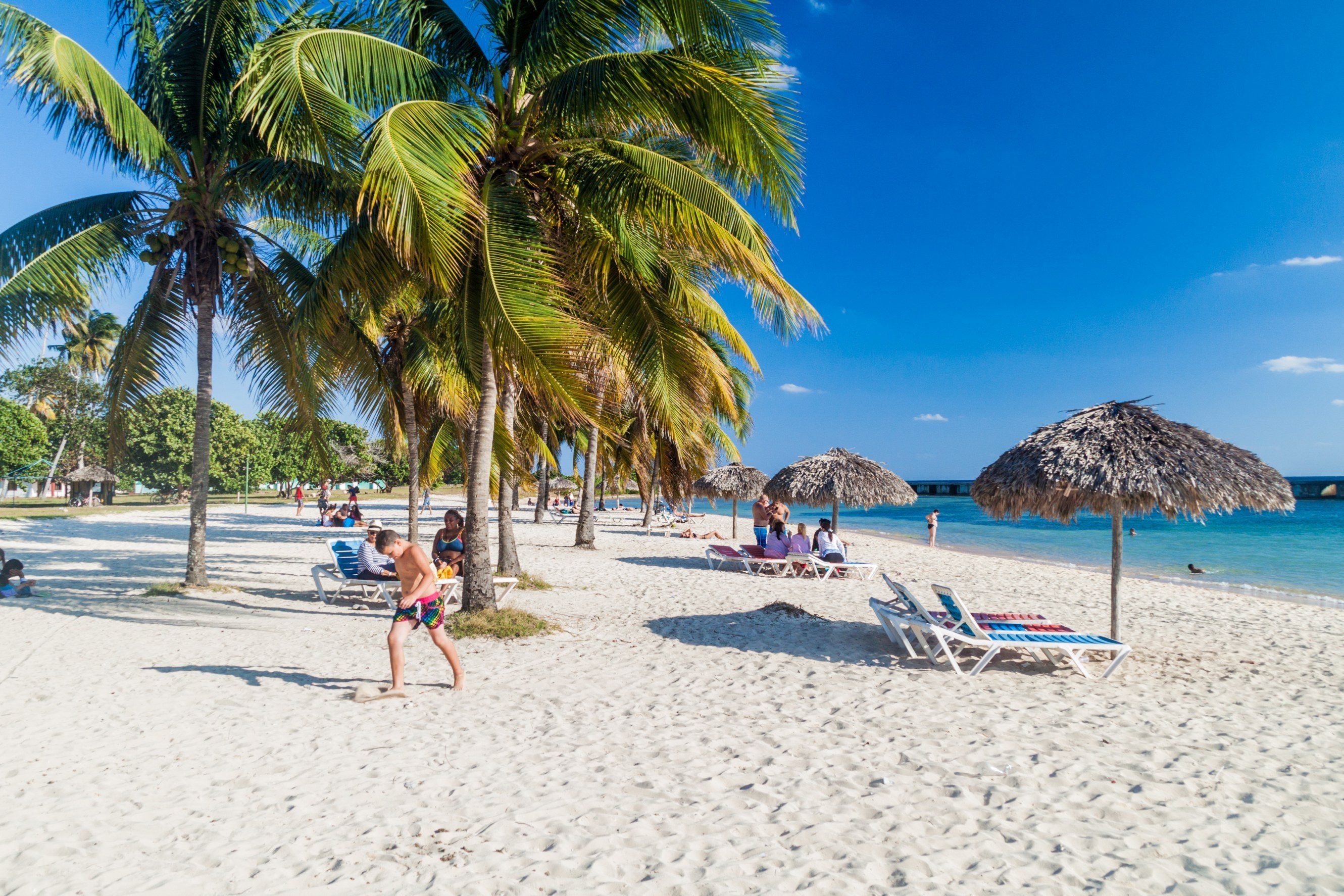 Shutterstock 473025436 Tourists At The Beach Playa Giron, Cuba