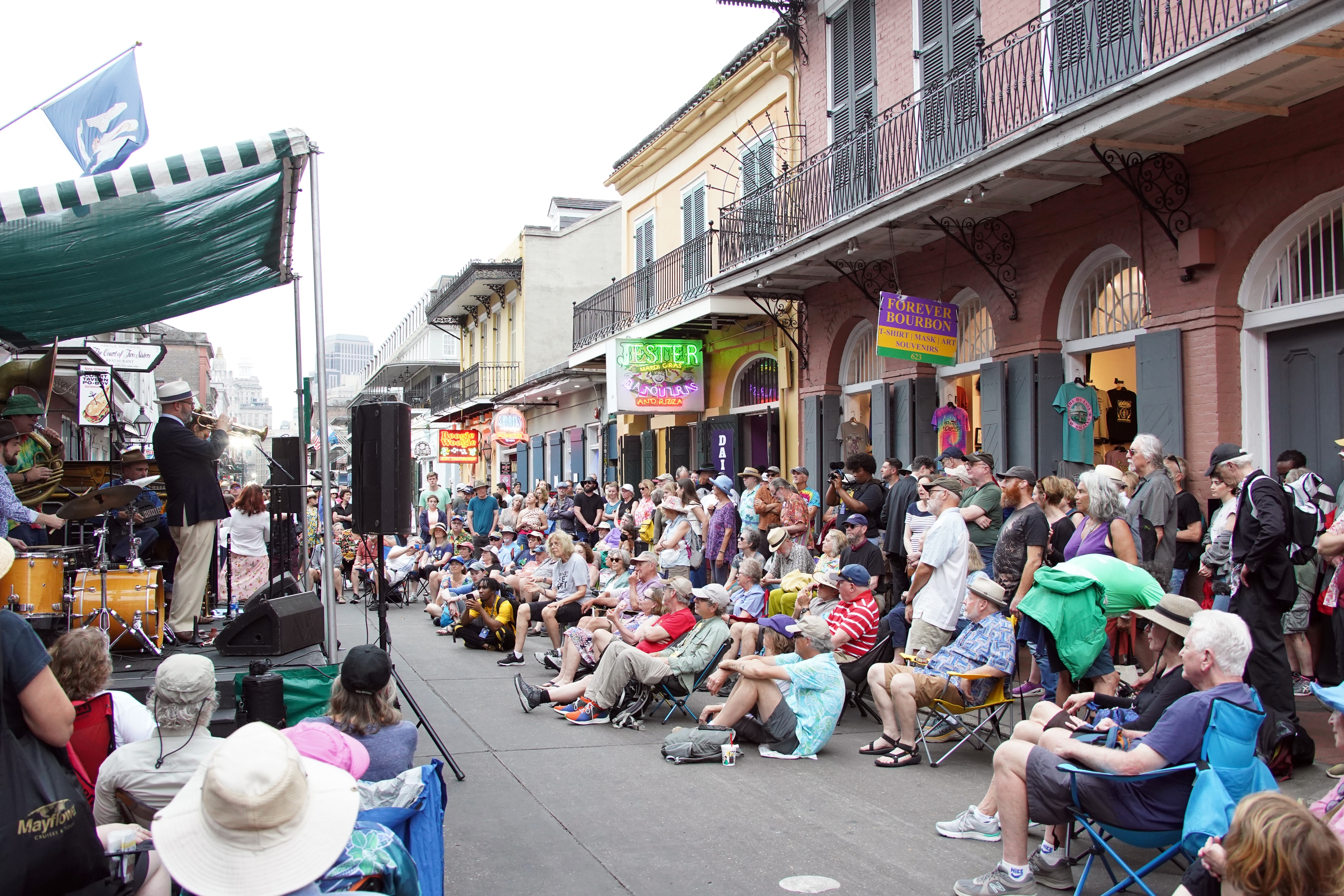 Shutterstock 2292177103 New Orleans, LA April 9, 2023 A Crowd Gathers On Bourbon Street In The Historic French Quarter In New Orleans, Louisiana For A Traditional Jazz Band.