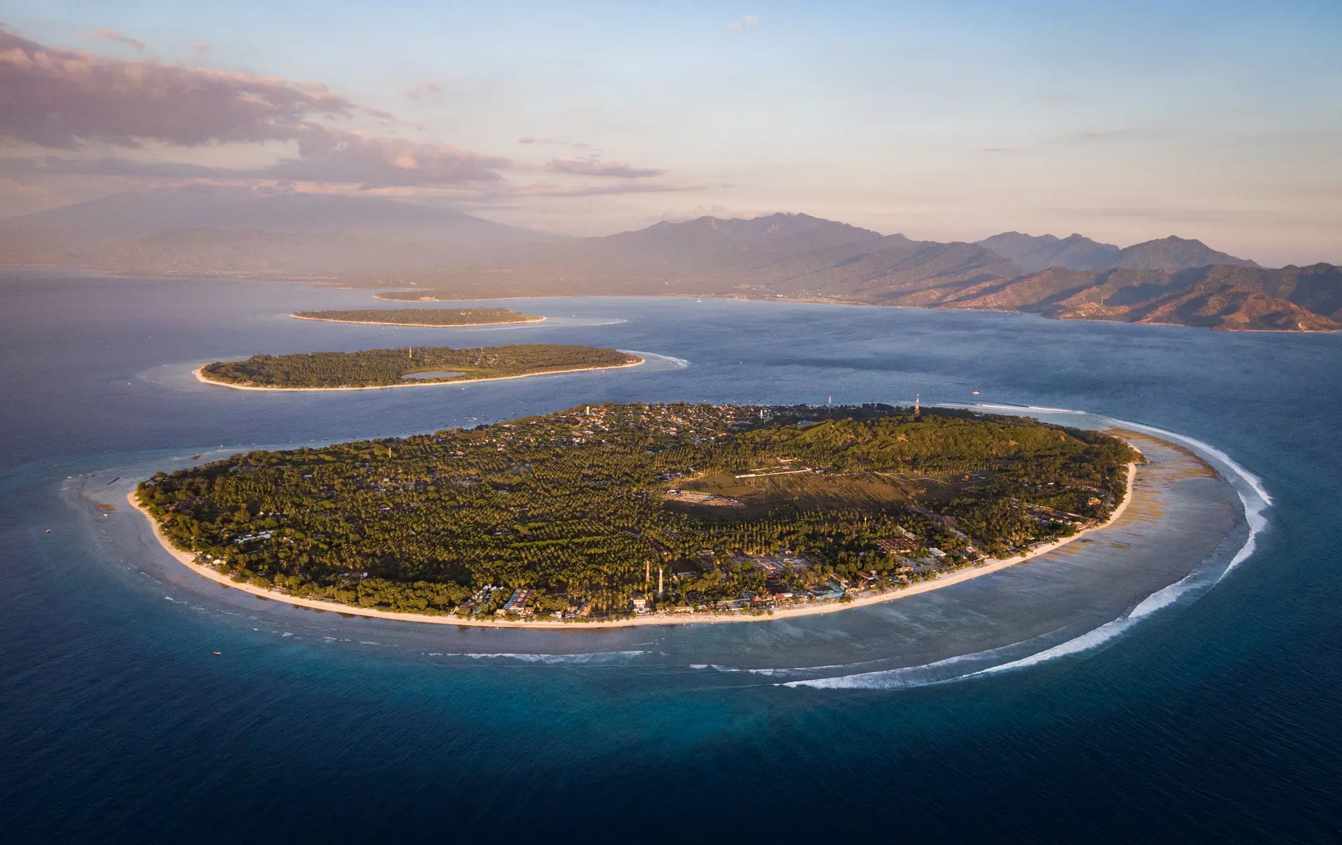 Shutterstock 1455243779 (Aerial View Of The Gili Islands Off The Coast Of Lombok, Indonesia, At Sunset. The Gilis Are The Most Popular Tourist Destination In Lombok.)