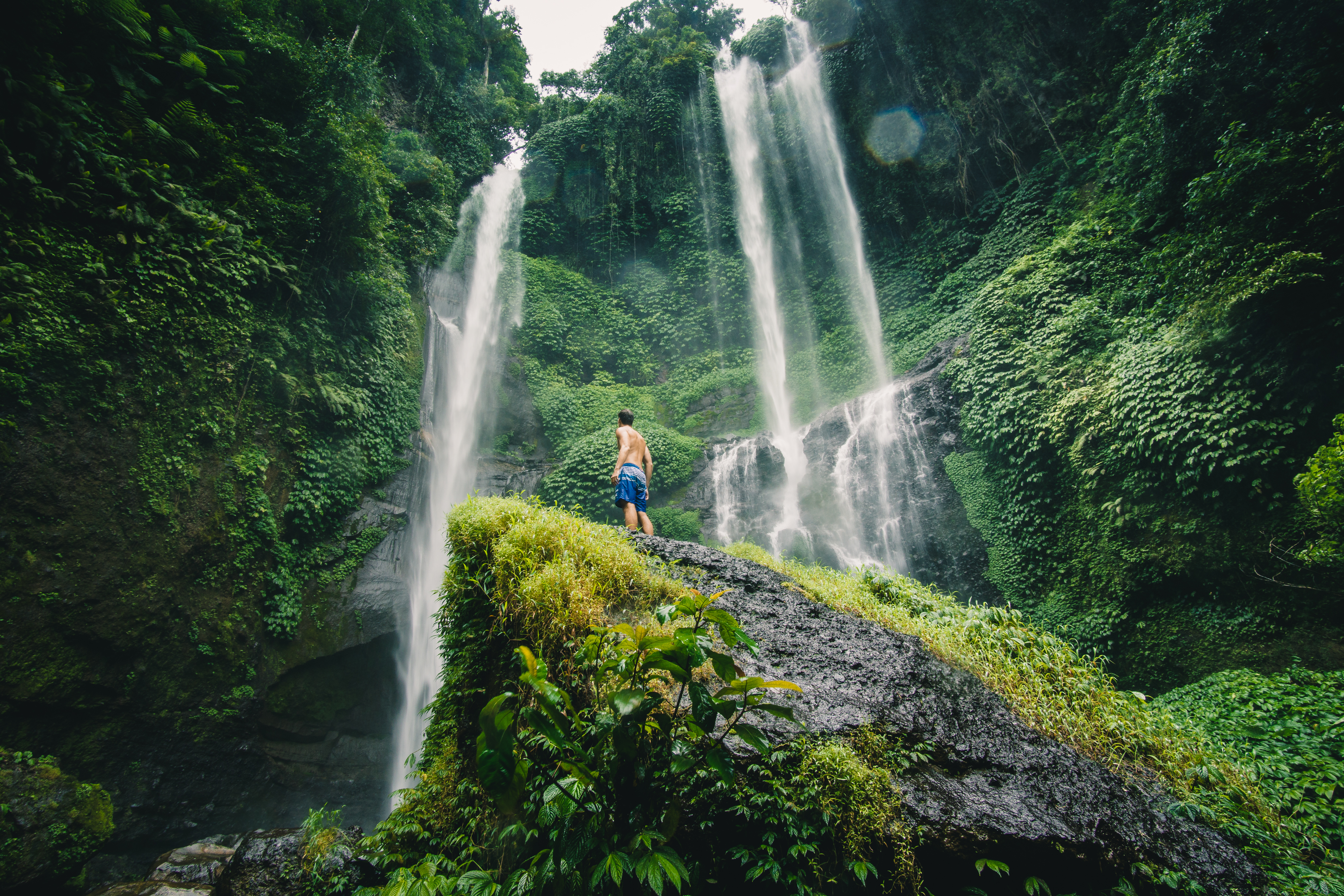 Sekumpul Waterfall In Bali Surrounded By Tropical Forest