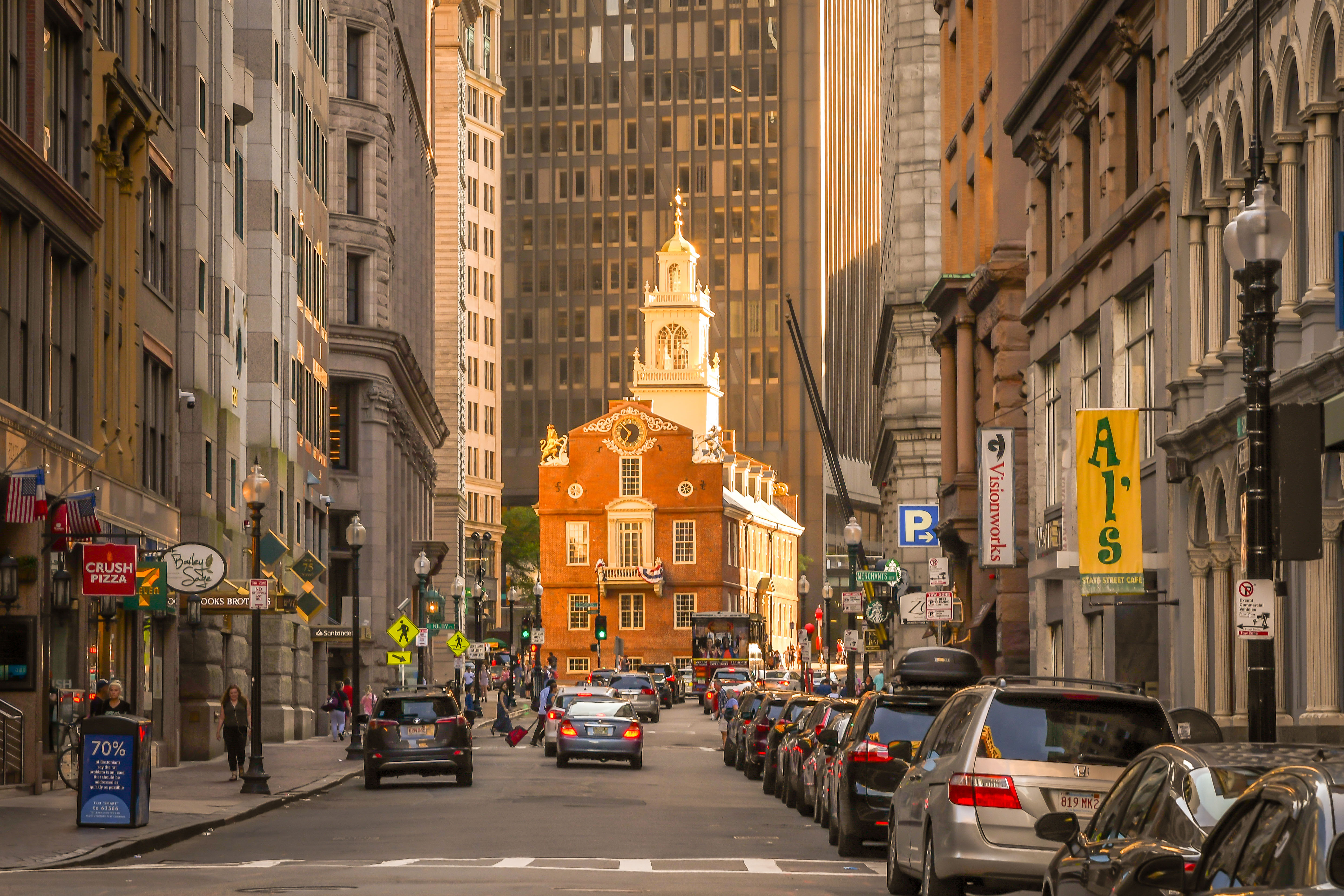 Shutterstock 1455713798 Boston, MA 7719 The View Down State Street, With The Setting Sun Illuminating The Old State House